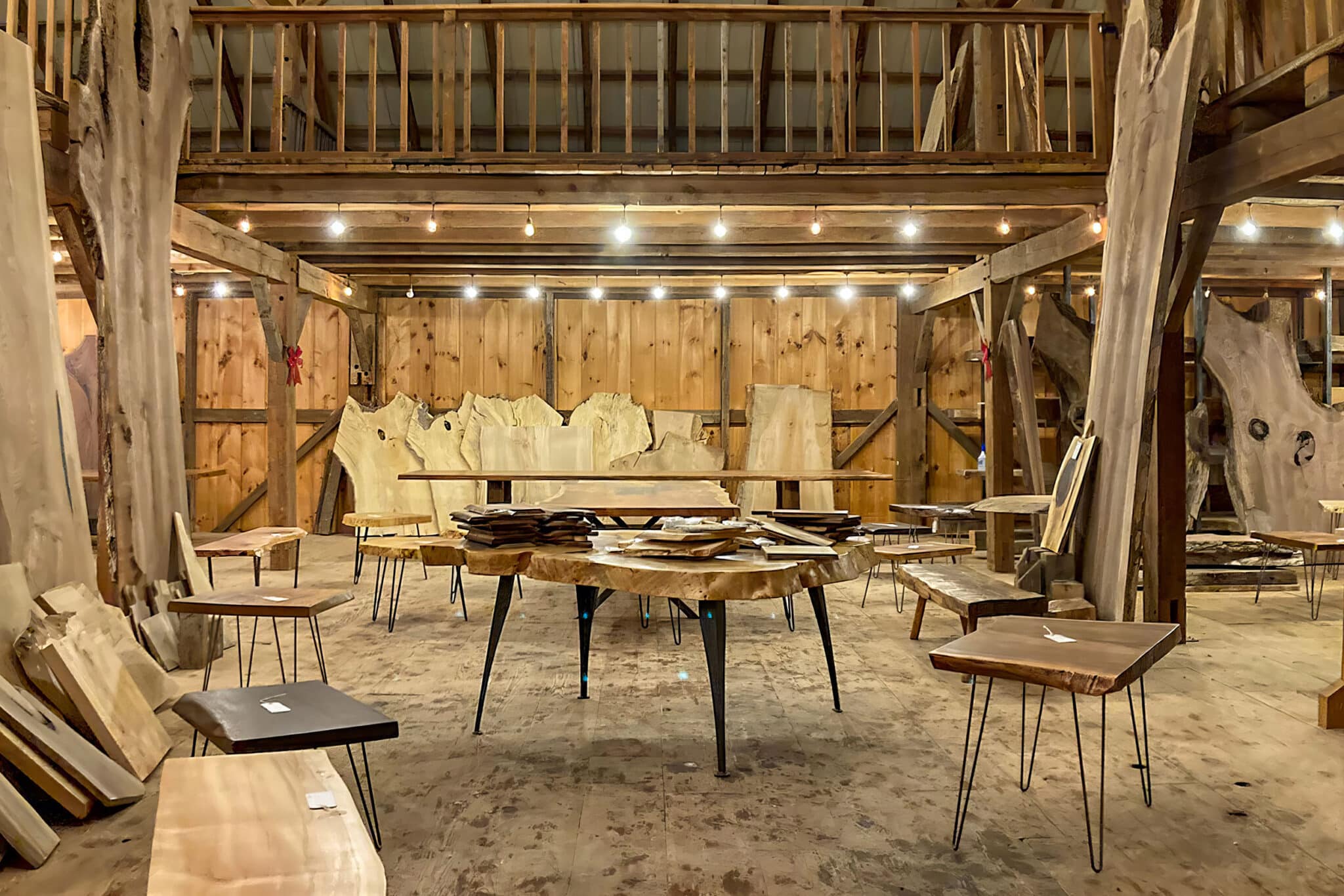 Barn in Idaho filled with reclaimed lumber and beams and live edge slabs