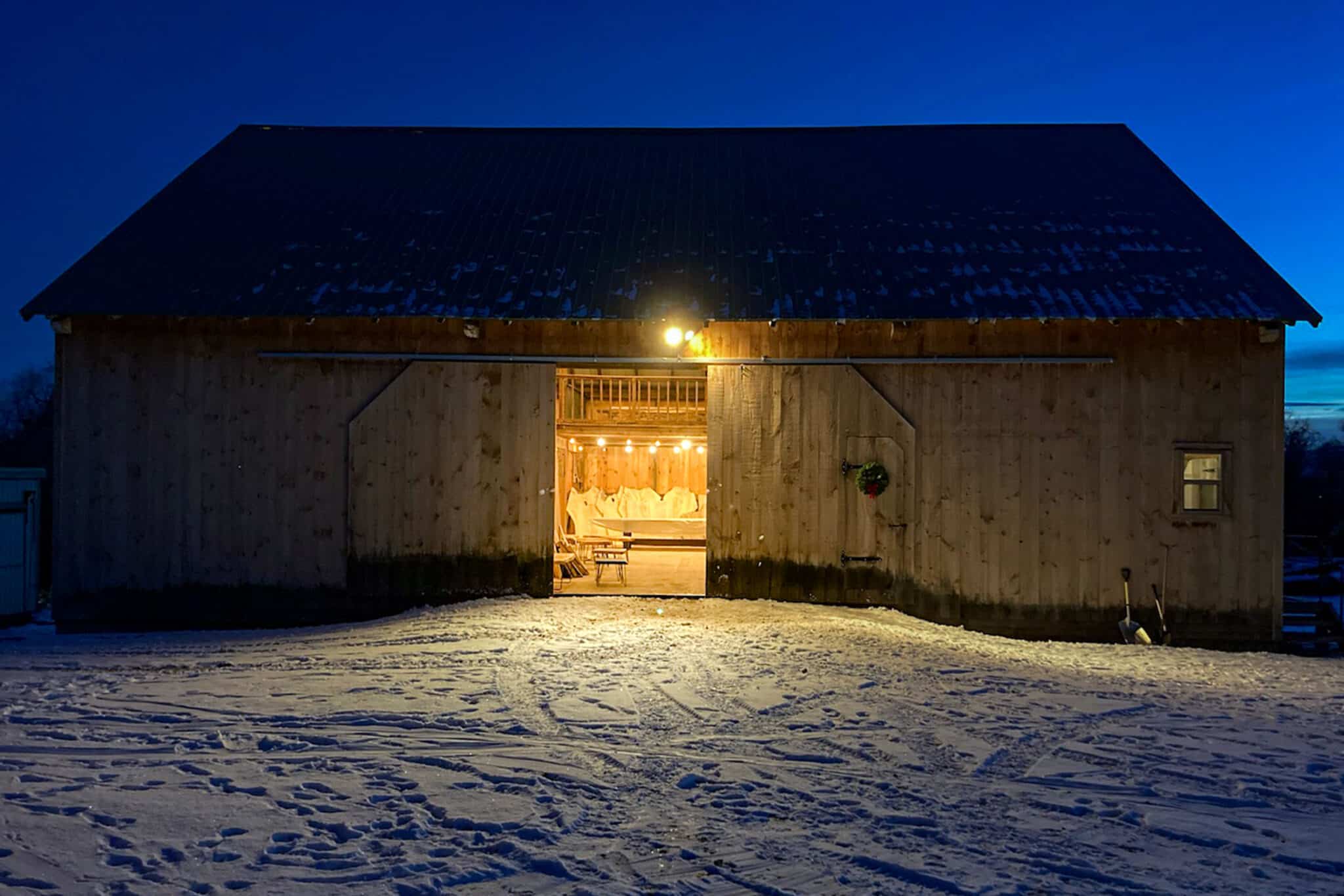 Barn in Idaho filled with reclaimed lumber and beams and live edge slabs