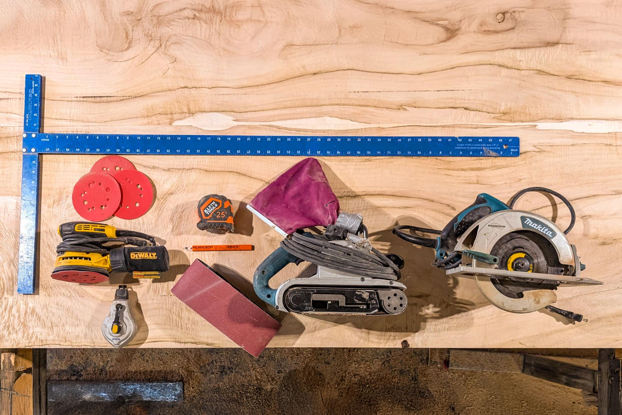 Selection of tools on a wood slab